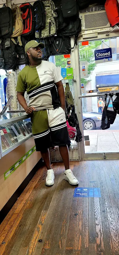 Customer by the bag wall at the store entrance