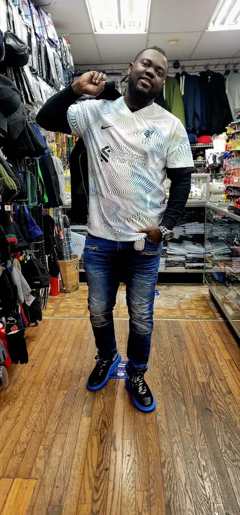 Customer in a Liverpool jersey inside the store